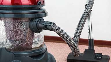 A red carpet cleaner on a carpet
