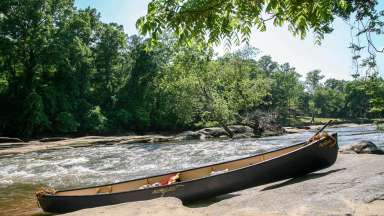 Canoe on banks of Neuse River