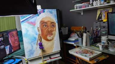 A painting on an easel in progress by Lakeshia Reed