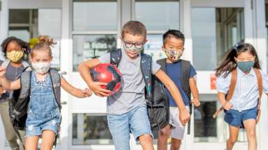 Kids running out of school building