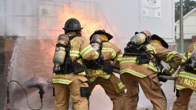 Firefighter recruits putting out blaze at training center
