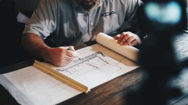 Man creating architecture drawing