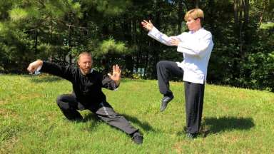 Two people doing kung fu moves