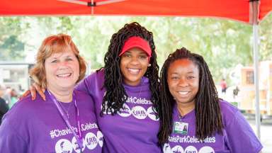 Three women smiling together