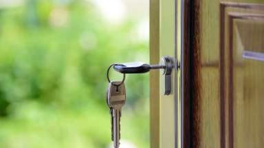 Key unlocking open door