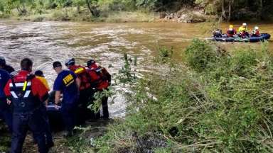 RFD fire fighters rescue along a river