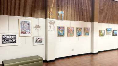 Artwork hangs on a gallery wall at Sertoma Arts Center