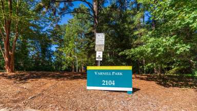 Sign for Varnell Park with trees in background