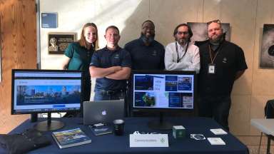 Communications Team at Exhibit Table