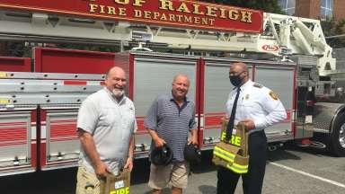 Club Members Present Equipment to Raleigh Fire Chief