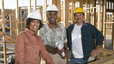 Diverse group of construction workers standing at a site