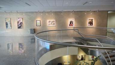 Artworks hang on the walls of Block Gallery at the Raleigh Municipal Building