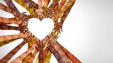Diverse hands heart and united diversity or unity partnership in a group of multicultural people connected together shaped as a support symbol expressing the feeling of teamwork and togetherness.