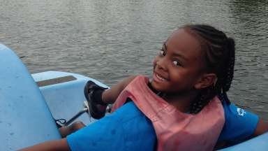 Girl riding in a a pedal boat