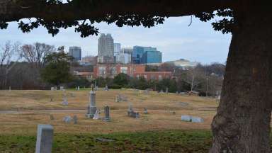 View of cemetery with Raleigh skyline in the background.