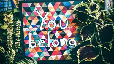 Colorful sign with the words "You Belong"