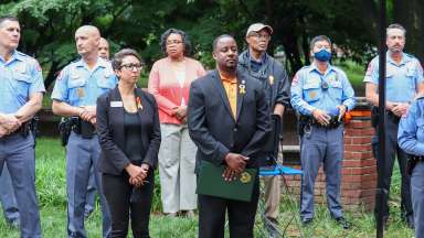 Police officers, council members, and community volunteers attend gun violence awareness event