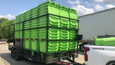 Trailer of yard waste containers for delivery