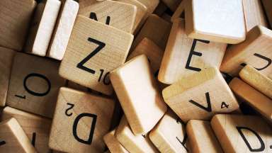 A pile of wooden letters from a scrabble game