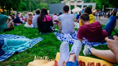 People watching a movie in the park