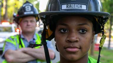 Image of Raleigh firefighter wearing black fire helmet