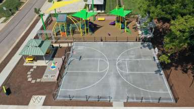 Aerial view of playground, basketball court and picnic area