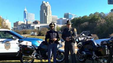 Raleigh police chief with skyline behind her
