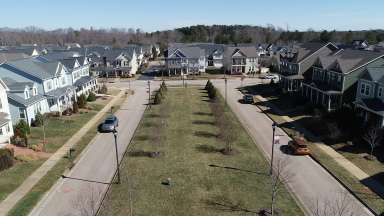 Veiw of Renaissance Park from above looking down two center streets with homes surrounding