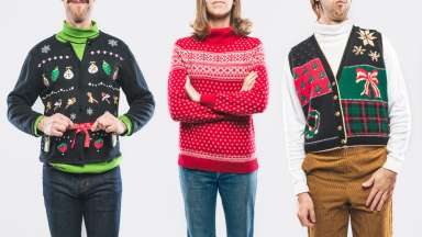 an image of three people all in Christmas sweaters