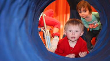 children in a tumbling tube