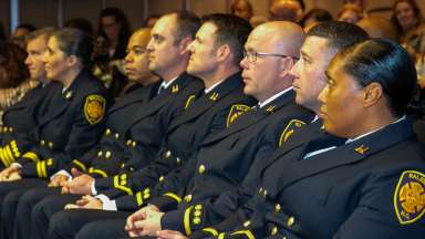Fire Fighters gather to recognize promotions and retirements.
