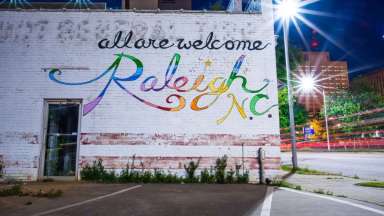 Mural in downtown Raleigh that says "All are welcome Raleigh NC"
