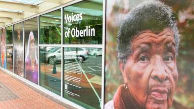 Portraits of Oberlin Village community members adorn the outside windows of Oberlin Regional Library