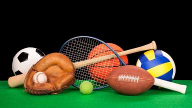 an image of a soccer ball, baseball and bat, tennis racket, football, volleyball and backetball