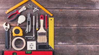 house renovation and improvement DIY tools on old wooden background