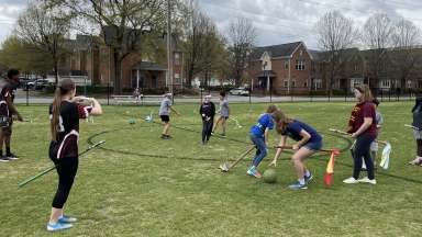 teens on a field playing quadball