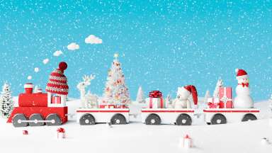 holiday toy train surrounded in snow