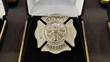 Close up of Ralegh Fire Department shield badge