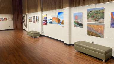 Gallery with paintings hung on the wall