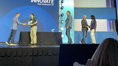 City employees on stage accepting 2024 Infinity Award at the Trimble Innovate 2024 User Conference