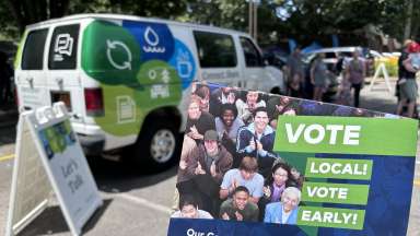 Vote Local Flyer with the community engagement van behind