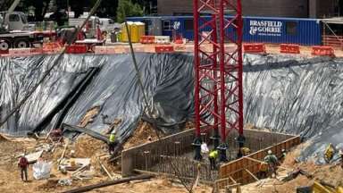 Image of construction site for City Hall with tower crane base