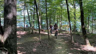 teens riding mountain bikes at forest ridge park