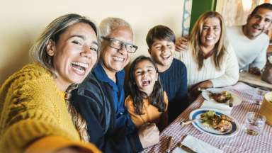 a family taking an intergenerational selfie