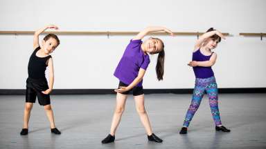 group of children practicing at dance studio