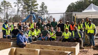 a group of volunteers after completing a garden build