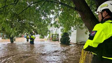 Firefighters conduct search and rescue efforts in Haywood County