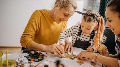 an intergenerational group of people making crafts