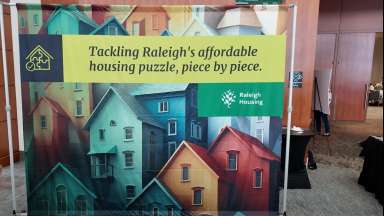 Banner that says &quot;Tackling Raleigh's Affordable Housing Puzzle, Piece by Piece&quot;
