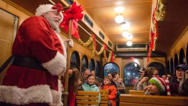 people in a holiday trolly